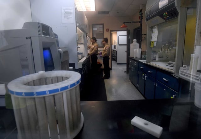 Workers are seen doing testing in the sampling lab during a tour of the Veolia facility in Port Arthur, on Thursday, April 19, 2024.