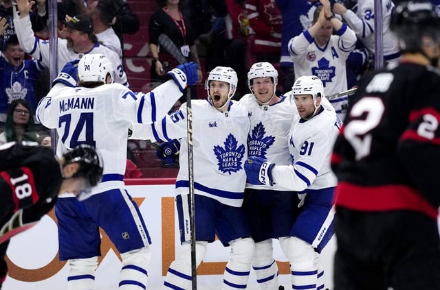 Toronto Maple Leafs defenceman Oliver Ekman-Larsson (95) celebrates his goal against the Senators with Bobby McMann (74), Jake McCabe (22) and John Tavares (91) as Ottawa forward Tim Stutzle (18) and defenceman Artem Zub (2) skate away during third period NHL playoff action in Ottawa on Saturday, April 26, 2025. THE CANADIAN PRESS/Justin Tang
