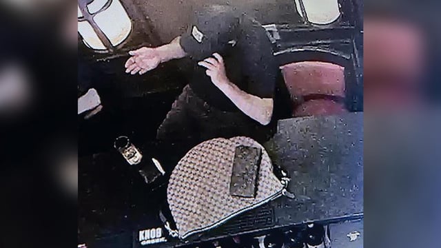 In this still from surveillance footage, Mario Bustamante Leiva is seen with Secretary of Homeland Security Kristi Noem's bag, according to the Justice Department.