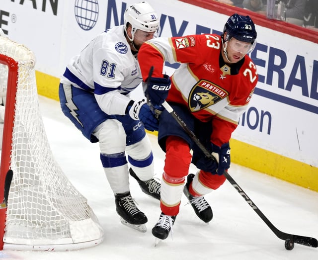 Tampa Bay Lightning Erik Cernak and Panthers’ Carter Verhaeghe match up during game 4 of the Eastern Conference at Amerant Bank Arena in Sunrise on Monday April 28, 2025.  (Carline Jean/South Florida Sun Sentinel)