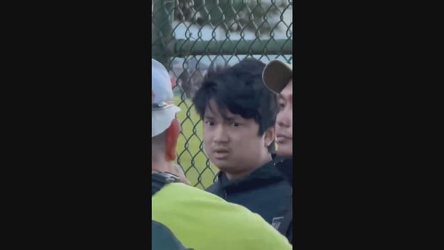 A screengrab from a video taken by onlookers after the Saturday festival shows a man who appears to be detained by security while onlookers shout accusations. Kai-Ji Adam Lo had been charged with eight counts of second-degree murder.