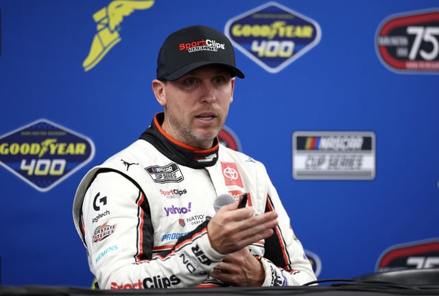 Denny Hamlin, driver of the #11 Sport Clips Haircuts Toyota, speaks to the media after winning the NASCAR Cup Series Goodyear 400 at Darlington Raceway on April 06, 2025 in Darlington, South Carolina.