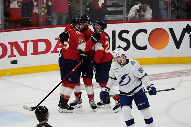 Panthers defenseman Aaron Ekblad (top center) celebrates after his goal against the Lightning during the third period of  Monday night&#39;s Game 4 in Sunrise.  (AP Photo/Marta Lavandier)