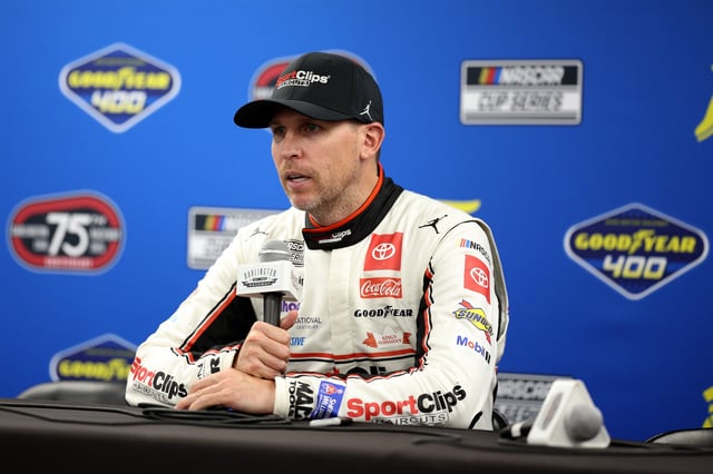 Denny Hamlin, driver of the #11 Sport Clips Haircuts Toyota, speaks to the media after winning the NASCAR Cup Series Goodyear 400 at Darlington Raceway on April 06, 2025 in Darlington, South Carolina.