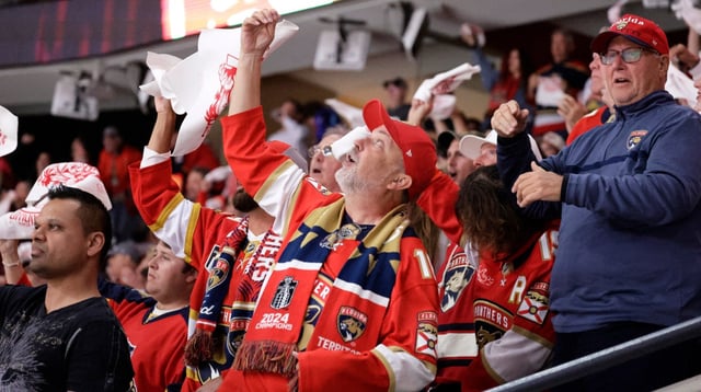 Florida Panthers fans celebrate after the team scored its first goal during Game 4 of the first round of the Eastern Conference playoffs against the Tampa Bay Lightning at Amerant Bank Arena in Sunrise, Fla., on Monday, April 28, 2025. (Carline Jean/South Florida Sun Sentinel)