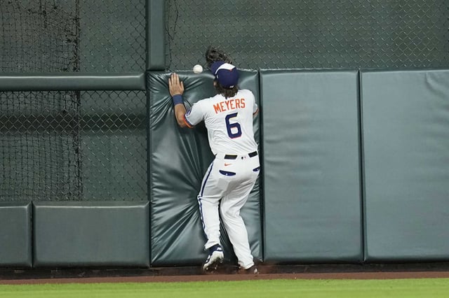 Houston Astros center fielder Jake Meyers hits the wall while trying to catch a double by Detroit Tigers&#39; Dillon Dingler during the ninth inning of a baseball game Monday, April 28, 2025, in Houston. (AP Photo/David J. Phillip)