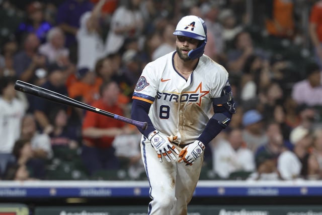 Apr 28, 2025; Houston, Texas, USA; Houston Astros first baseman Christian Walker (8) flips his bat after hitting a home run during the fourth inning against the Detroit Tigers at Daikin Park. Mandatory Credit: Troy Taormina-Imagn Images