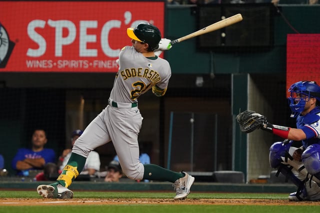 Apr 28, 2025; Arlington, Texas, USA; Athletics first baseman Tyler Soderstrom (21) follows through on a two-run double against the Texas Rangers during the fifth inning at Globe Life Field. Mandatory Credit: Raymond Carlin III-Imagn Images