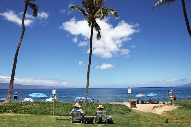 People gather along Kaanapali Beach on August 5, 2024 near Lahaina, Hawaii.