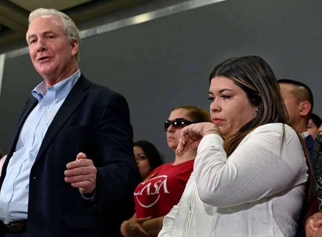 Sen. Chris Van Hollen, left, speaks to the media at Dulles Airport on his meeting with Kilmar Garcia in El Salvador yesterday and the overall situation as Jennifer Vasquez Sura wife of Garcia wipes away tears. (Kenneth K. Lam/Staff)
