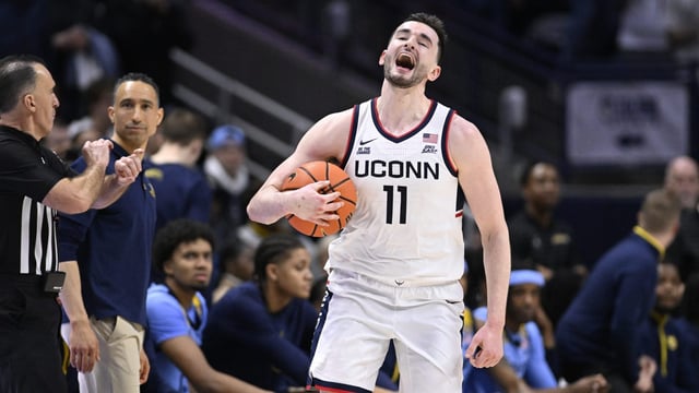 UConn forward Alex Karaban (11) reacts at the end of an NCAA college basketball game against Marquette, Wednesday, March 5, 2025, in Storrs, Conn. (AP Photo/Jessica Hill)
