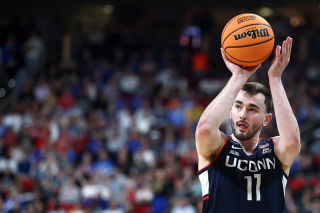 RALEIGH, NORTH CAROLINA – MARCH 23: Alex Karaban #11 of the Connecticut Huskies attempts a three point basket in the second round of the NCAA Men’s Basketball Tournament against the Florida Gators at Lenovo Center on March 23, 2025 in Raleigh, North Carolina.  (Photo by Jared C. Tilton/Getty Images)