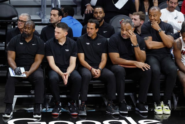 Heat coach Erik Spoelstra his staff sit in the bench during the second half in Game 4 of an NBA basketball first-round playoff series against the Cleveland Cavaliers, Monday, April 28, 2025, in Miami. (AP Photo/Rhona Wise)