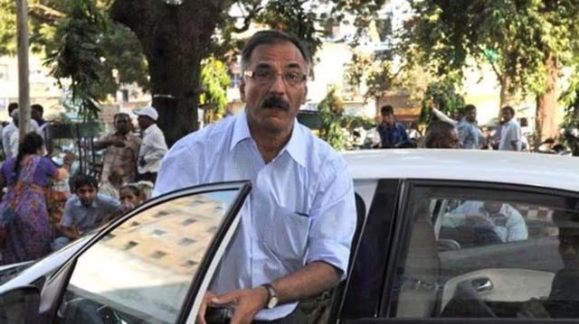 Ex-IAS officer Pradeep Sharma misused his position as Bhuj district collector for illegal government land allotment. 