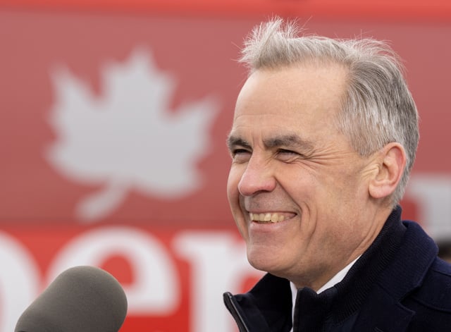 Liberal Leader Mark Carney smiles as he speaks at a campaign event at the Port of Montreal on Friday March 28, 2025.