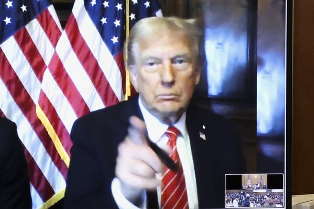 Then president-elect Donald Trump appears remotely for a sentencing hearing in front of New York State Judge Juan Merchan in the criminal case in which he was convicted in 2024 on charges involving hush money paid to a porn star, at New York Criminal Court in Manhattan in New York City, on Jan. 10.