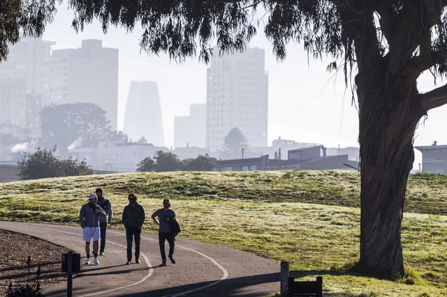 People walk and jog along a path in Fort Mason near Marina Boulevard in San Francisco. Medical experts say the viral “fart walk” after meals can aid digestion, regulate blood sugar and boost overall health.