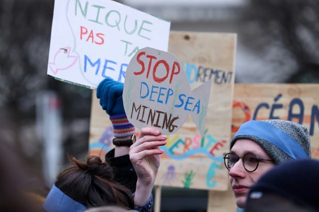 Activists rally against deep sea mining outside the European Parliament in March 2023