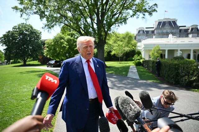 President Donald Trump speaks to the media as he walks to board Marine One at the White House in Washington, DC, on April 29, 2025, as he departs for a rally in Michigan to mark his 100th day in office.
