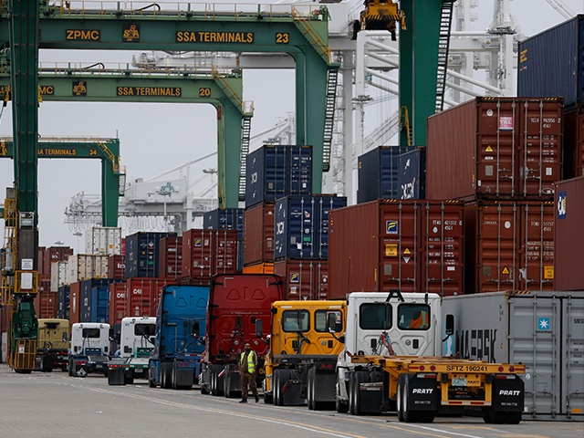 OAKLAND, CALIFORNIA - APRIL 18: Trucks line up to pick up shipping containers from a ship at the Port of Oakland on April 18, 2025 in Oakland, California. The commercial transportation industry is bracing for a sudden drop in work as fallout from U.S. President Donald Trump's sweeping tariffs continues. American importers are being notified of a surge in canceled sailings by freight ships out of China after the Trump administration announced new fees on Chinese ships. (Photo by Justin Sullivan/Getty Images)