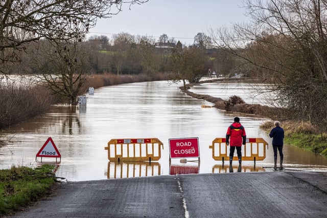 The flooded River Avon on the road to Eckington bridge in January 2024. Credit: Martin Bache / Alamy Stock Photo