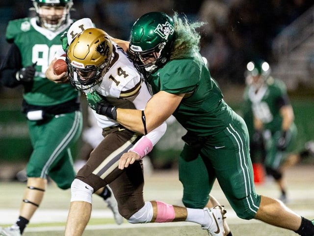  University of Saskatchewan Huskies linebacker Seth Hundeby (4) tackles Manitoba Bisons Jackson Tachinski at Griffiths Stadium in Nutrien Park. Photo taken in Saskatoon, Sask. on Friday, October 4, 2024.