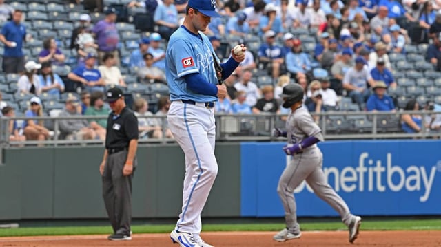 Kansas City Royals starting pitcher Cole Ragans (55) reacts after giving up a two-run home run to Colorado Rockies Hunter Goodman (left) in the third inning at Kauffman Stadium.