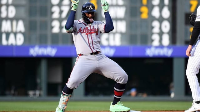 Apr 29, 2025; Denver, Colorado, USA; Atlanta Braves outfielder Michael Harris II (23) celebrates after a two-RBI double during the second inning against the Colorado Rockies at Coors Field. Mandatory Credit: Christopher Hanewinckel-Imagn Images