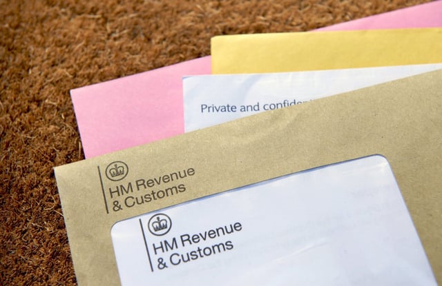 Caption: A sharp intake of breath accompanies the arrival of a brown HMRC letter on the doormat. MPs say it need to modernise (Photo by Peter Dazeley/Getty)