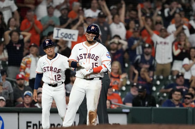 Houston Astros Isaac Paredes (15) smiles after hitting an RBI triple in the seventh inning of a MLB baseball game at Daikin Park in Houston, Tuesday, April 29, 2025.