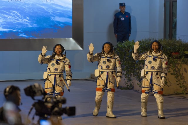 FILE- Chinese astronauts Wang Haoze, from left, Cai Xuzhe and Song Lingdong wave as they attend the see-off ceremony for the Shenzhou-19 mission at the Jiuquan Satellite Launch Center in northwestern China, in the early hours of Oct. 30, 2024. (AP Photo/Ng Han Guan, File)