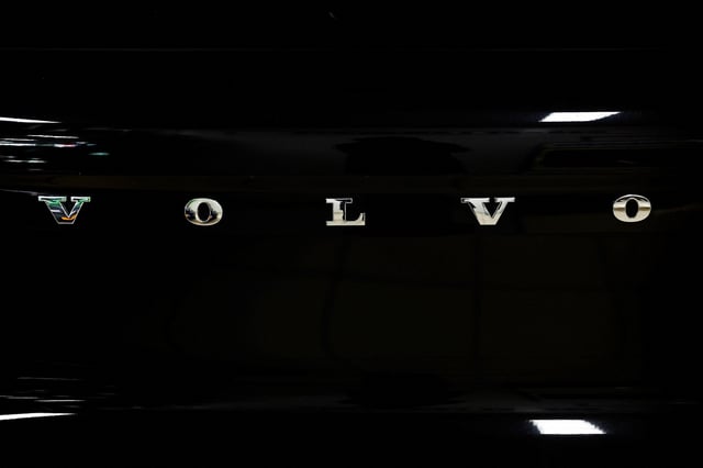 A logo of Volvo is seen inside a car dealer in Nijmegen, Netherlands February 26, 2025. REUTERS/Piroschka van de Wouw/File Photo
