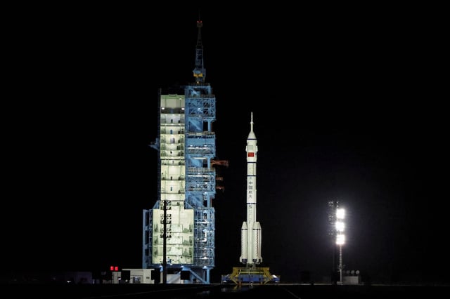 A Long March-2F rocket carrying the Shenzhou-19 spacecraft sits at the launch pad before taking off from the Jiuquan Satellite Launch Center for a crewed mission to China's Tiangong space station, near Jiuquan, Gansu province, China October 30, 2024. REUTERS/Florence Lo/File Photo