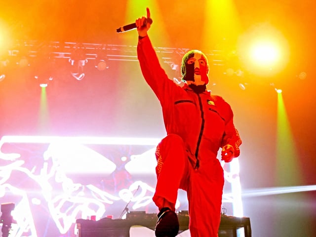 DJ Provai from Irish Hip Hop trio Kneecap performs onstage during the 2025 Coachella Valley Music and Arts Festival at Empire Polo Club on April 11, 2025 in Indio, California. (Photo by VALERIE MACON / AFP) / RESTRICTED TO EDITORIAL USE