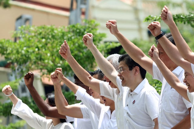Singapore's Prime Minister Lawrence Wong gestures at a People's Action Party (PAP) lunchtime rally ahead of the general election, in Singapore's central business district, April 28, 2025. REUTERS/Edgar Su