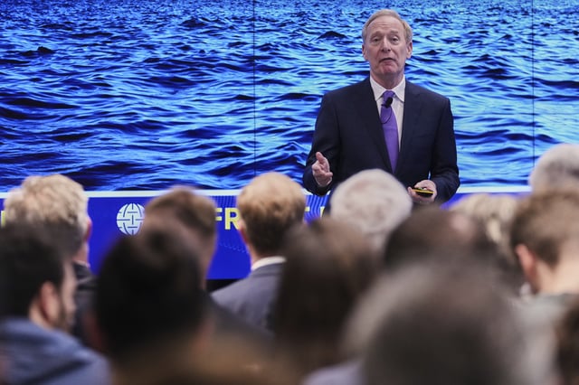 Microsoft's President Brad Smith speaks during a conference on digital resilience during geopolitical volatility in Brussels, Wednesday, April 30, 2025. (AP Photo/Virginia Mayo)