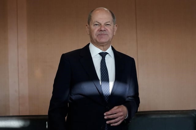 FILE - German Chancellor Olaf Scholz arrives for a German government cabinet meeting at the chancellery in Berlin, Germany, Nov. 27, 2024. 