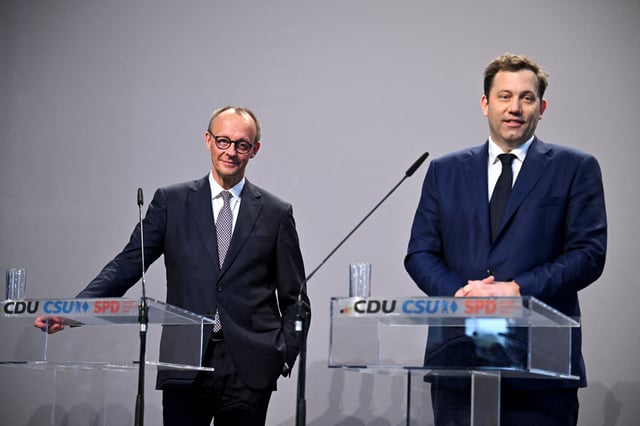 Germany's chancellor-in-waiting and leader of the Christian Democratic Union party (CDU) Friedrich Merz and co-leader of the Social Democratic party (SPD) Lars Klingbeil attend a press conference after reaching an agreement on their coalition government in Berlin, Germany, April 9, 2025. REUTERS/Annegret Hilse/File Photo