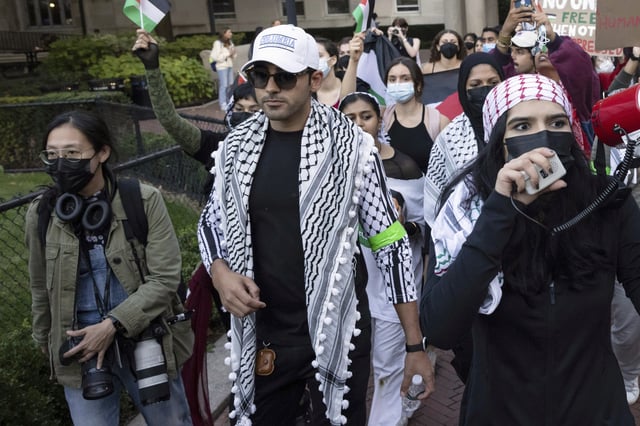 FILE - Mohsen Mahdawi, center, looks on during a pro-Palestinian protest at Columbia University, Thursday, Oct. 12, 2023, in New York. (AP Photo/Yuki Iwamura, File)