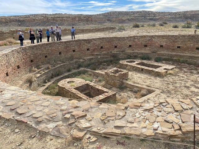Tourists view Pueblo Bonito, one of a series of Puebloan structures in Chaco Culture National Historical Park believed to have been used as ceremonial as well as administrative and trading centers and built over multiple decades between the 9th and 12 centuries, in Chaco Canyon, New Mexico, U.S. October 21, 2021.   REUTERS/Dan Grebler/File Photo