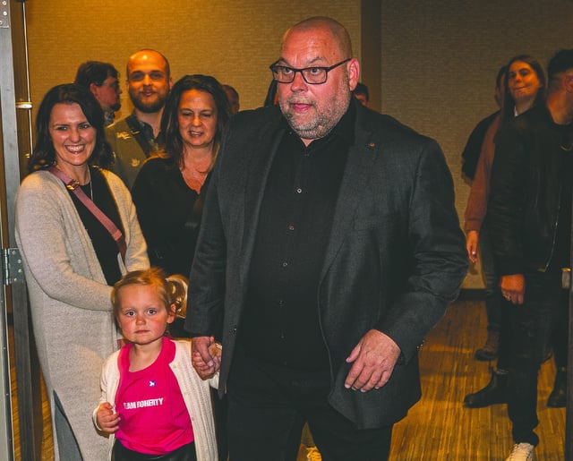 Incumbent Conservative MP Todd Doherty and his with his four-year-old granddaughter Ren walk into his re-election celebration at the Courtyard by Marriott Monday, April 28, 2025.