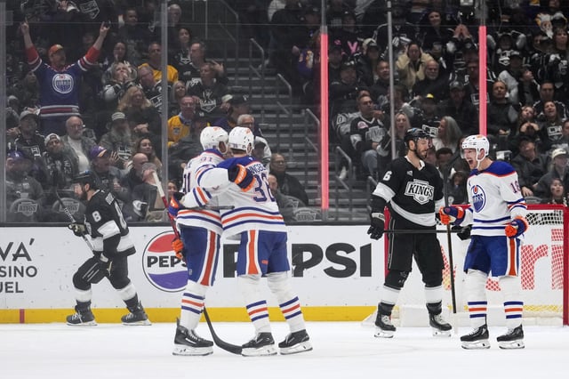 Edmonton Oilers left wing Evander Kane (91) celebrates his goal with defenceman John Klingberg (36) and left wing Zach Hyman (18) as Los Angeles Kings defenceman Joel Edmundson (6) skates away during the second period in Game 5 of an NHL hockey first-round playoff series Tuesday, April 29, 2025, in Los Angeles. 