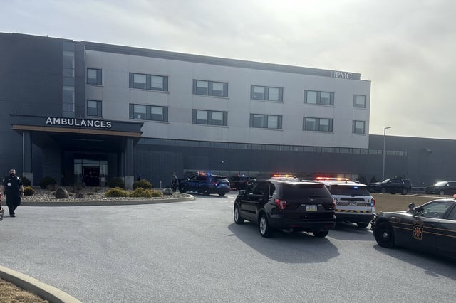 FILE - Law enforcement arrive at the scene of a shooting at UPMC Memorial Hospital in York, Pa., Feb. 22, 2025. (AP Photo/Mark Scolforo, File)