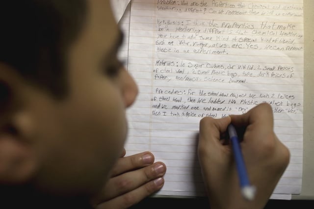 A boy receives help with homework exercises from AmeriCorps-funded volunteers at the Arab American Association of New York office in Bay Ridge in 2010.