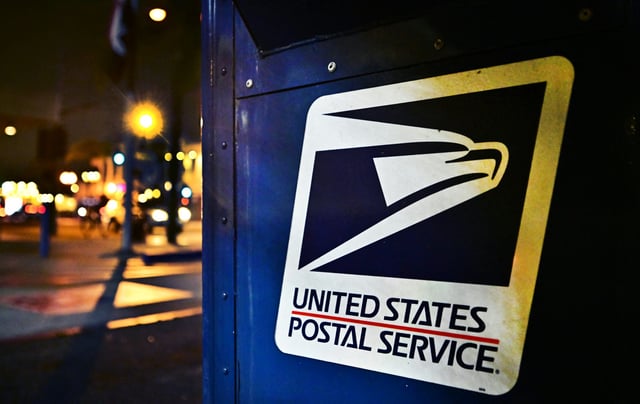 The United State Postal Service emblem is seen on the side of a mailbox in Monterey Park, California on February 4, 2025.
