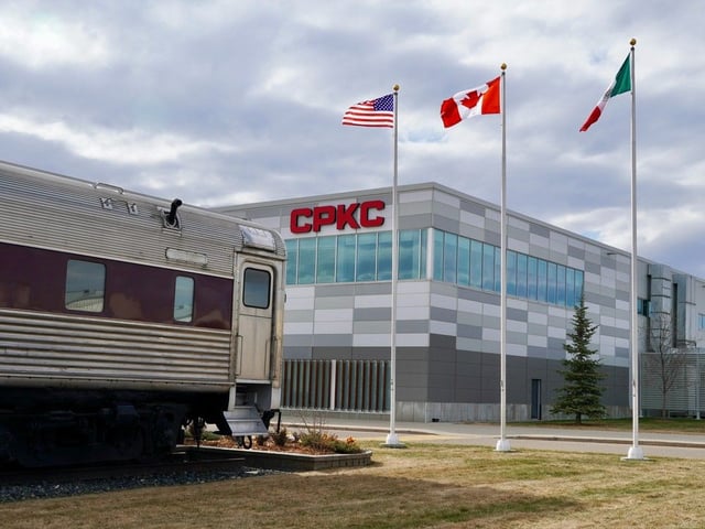 CPKC CEO Keith Creel says uncertainty fuelled by shifting tariffs and a risk of recession prompted more moderate earnings expectations for the company. The flags of the United States, Canada and Mexico fly at CPKC headquarters in Calgary on April 24, 2024.