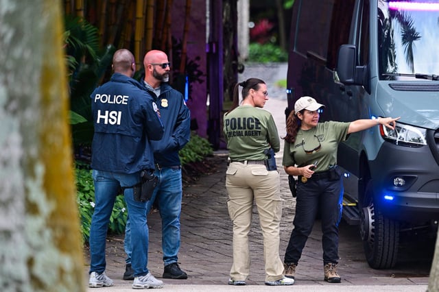 Federal and Homeland Security Investigations agents are seen at the entrance of Sean "Diddy" Combs' home at Star Island in Miami Beach, Florida, on March 25, 2024.