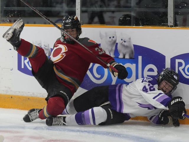 Ottawa Charge forward Rebecca Leslie (37) and Minnesota Frost defence Claire Thompson (42) collide along the boards 
during first period PWHL action on Wednesday in Ottawa. 