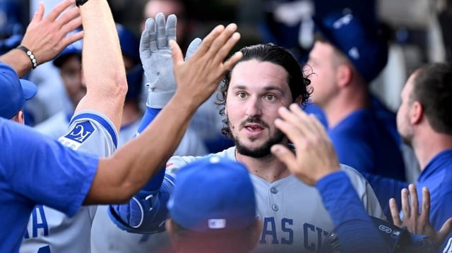 Apr 30, 2025; St. Petersburg, Florida, USA; Kansas City Royals first baseman Vinnie Pasquantino (9) celebrates with his teammates after hitting a two-run home run in the first inning against the Tampa Bay Rays at George M. Steinbrenner Field. Mandatory Credit: Jonathan Dyer-Imagn Images