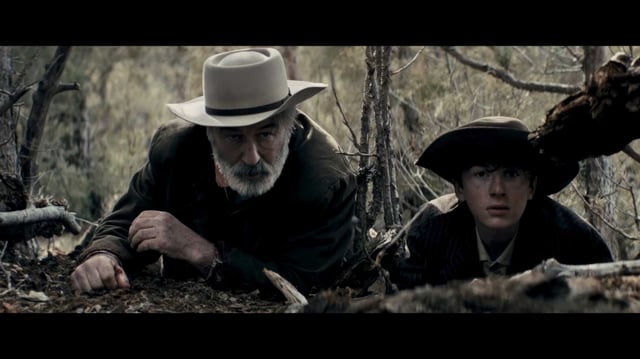 Alec Baldwin, from left, and Patrick Scott McDermott are on the run from bounty hunters in “Rust.”